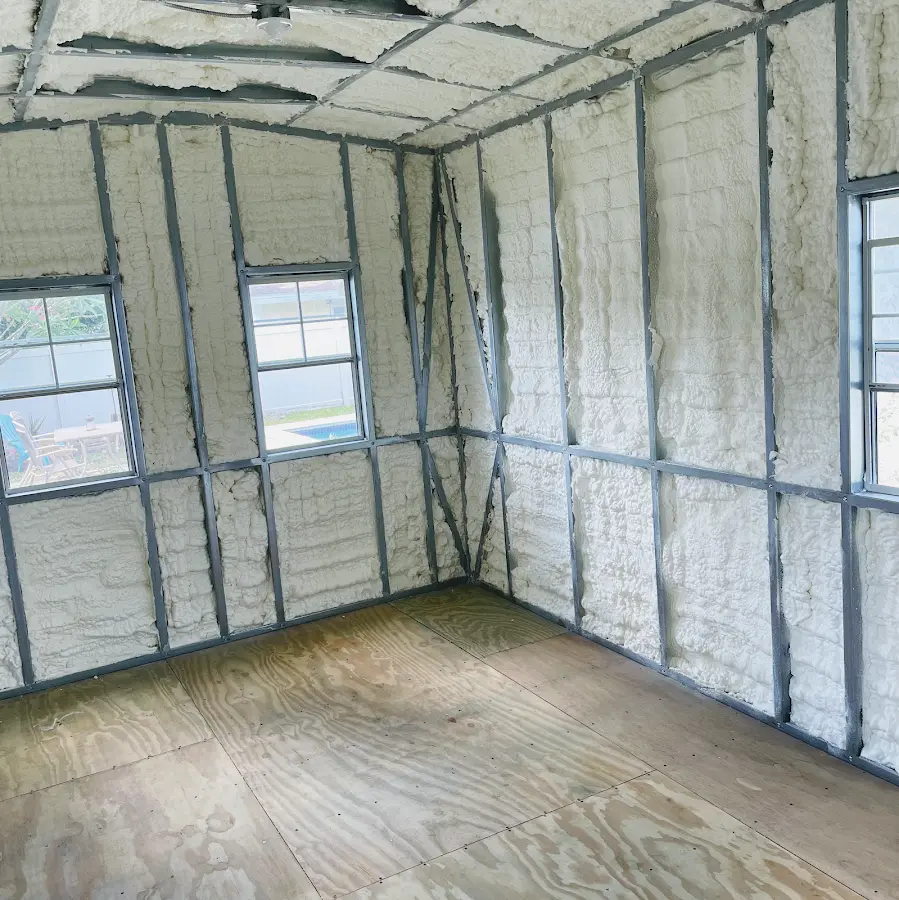 Closed-cell spray foam insulation applied to wall cavities in a residential project in Kendallville